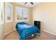 Comfortable bedroom with neutral walls, plush carpet, and window with shutter at 2128 Delmar Farms Ct, Laughlin, NV 89029