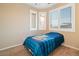 Comfortable bedroom featuring neutral walls, plush carpet, and window with shutter at 2128 Delmar Farms Ct, Laughlin, NV 89029