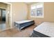 Inviting bedroom featuring neutral walls, plush carpet and a window with shutter at 2128 Delmar Farms Ct, Laughlin, NV 89029