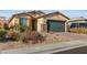 Beautiful single-story home with desert landscaping and a well-manicured yard at 2128 Delmar Farms Ct, Laughlin, NV 89029