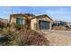 Charming single-story home with a well-maintained front yard and attached two-car garage at 2128 Delmar Farms Ct, Laughlin, NV 89029