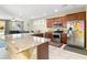 Open kitchen with granite countertops, stainless steel appliances, and seating area nearby at 2128 Delmar Farms Ct, Laughlin, NV 89029