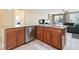 Kitchen island with granite countertops, stainless steel appliances, and wooden cabinets at 2128 Delmar Farms Ct, Laughlin, NV 89029