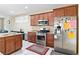 Kitchen with stainless steel appliances, granite countertops, and wooden cabinets at 2128 Delmar Farms Ct, Laughlin, NV 89029