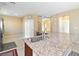 Kitchen with a large island featuring granite countertops and stainless steel sink at 2128 Delmar Farms Ct, Laughlin, NV 89029