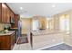 Spacious kitchen features granite counters, stainless steel appliances, tile flooring, and generous counter space at 2128 Delmar Farms Ct, Laughlin, NV 89029