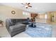 Bright living area with neutral walls, open floorplan, ceiling fan, and tile flooring at 2128 Delmar Farms Ct, Laughlin, NV 89029