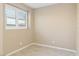 Bright, neutral room with tile flooring, baseboards, and natural light streaming in through the window at 2128 Delmar Farms Ct, Laughlin, NV 89029