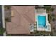 The tile roof is complemented by a pool, spa, covered patio, and outdoor seating area at 2153 King Crest Ct, Henderson, NV 89052