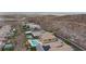 A neighborhood showcases modern homes with swimming pools, offering a luxurious desert living experience with a distant city view at 2153 King Crest Ct, Henderson, NV 89052
