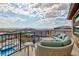 Relax on this comfortable balcony furniture with views of the pool and the mountainous landscape at 2153 King Crest Ct, Henderson, NV 89052