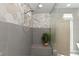 Bright shower showcases a bench seat, neutral tiling, and a rain shower head at 2153 King Crest Ct, Henderson, NV 89052