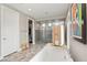 Bright bathroom showcases a soaking tub, glass-enclosed shower, and tiled accent wall at 2153 King Crest Ct, Henderson, NV 89052