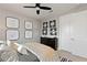 Stylish bedroom features a ceiling fan, decorative wall art, and neutral decor at 2153 King Crest Ct, Henderson, NV 89052