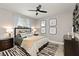 Comfortable bedroom with a ceiling fan, contemporary decor, and a plush rug providing a stylish and inviting feel at 2153 King Crest Ct, Henderson, NV 89052