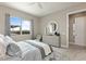 Serene bedroom featuring a large window with backyard views and stylish furnishings promoting comfort and relaxation at 2153 King Crest Ct, Henderson, NV 89052
