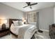 Cozy bedroom with a comfortable bed, soft lighting, and a window view at 2153 King Crest Ct, Henderson, NV 89052
