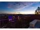 Scenic city view at dusk from a backyard patio with mountain views at 2153 King Crest Ct, Henderson, NV 89052