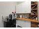 A convenient in-home coffee bar with white cabinets and a wooden countertop provides ample space for beverage preparation at 2153 King Crest Ct, Henderson, NV 89052