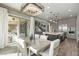 Open concept dining room with backyard access, featuring modern lighting and backyard access at 2153 King Crest Ct, Henderson, NV 89052
