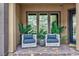 Charming front porch features cozy seating area perfect for relaxing at 2153 King Crest Ct, Henderson, NV 89052