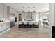 Spacious kitchen features a large island with seating, stainless steel appliances, and wood flooring at 2153 King Crest Ct, Henderson, NV 89052