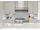 Close-up of the kitchen with stainless steel appliances and decorative tile backsplash at 2153 King Crest Ct, Henderson, NV 89052