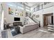 Stylish living room with high ceilings, modern decor, and staircase at 2153 King Crest Ct, Henderson, NV 89052