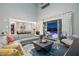 Open concept living area with modern kitchen and a view of the inviting pool and patio at 2153 King Crest Ct, Henderson, NV 89052