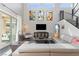 Modern living room featuring a large sectional sofa, high ceilings, and contemporary artwork at 2153 King Crest Ct, Henderson, NV 89052