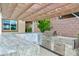 Outdoor kitchen features granite countertops, stainless steel grill, and ample cabinet space at 2153 King Crest Ct, Henderson, NV 89052