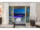 Living room showcasing view of the patio with a stylish outdoor seating area and pool at 2153 King Crest Ct, Henderson, NV 89052