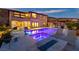 Wide shot of backyard pool, spa, and outdoor kitchen at 2153 King Crest Ct, Henderson, NV 89052
