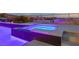 Backyard jacuzzi is illuminated at dusk at 2153 King Crest Ct, Henderson, NV 89052