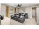 Comfortable home theater with plush seating and a modern ceiling fan at 2153 King Crest Ct, Henderson, NV 89052