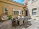 Cozy outdoor patio featuring modern furniture, a geometric rug, and views of the architecture at 220 Villa Borghese St, Las Vegas, NV 89138