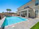 Scenic backyard with a luxurious pool, covered patio, and ample space for entertainment at 220 Villa Borghese St, Las Vegas, NV 89138