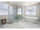 Luxury bathroom featuring a modern soaking tub, frameless glass shower, and elegant lighting at 220 Villa Borghese St, Las Vegas, NV 89138