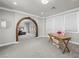 Open bedroom with a wooden archway and a separate seating and desk area at 220 Villa Borghese St, Las Vegas, NV 89138
