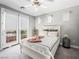 Bedroom with a queen bed, balcony access, and gray walls providing a peaceful retreat at 220 Villa Borghese St, Las Vegas, NV 89138