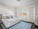 Bedroom with a tufted headboard, neutral colors, and multiple windows providing ample natural light at 220 Villa Borghese St, Las Vegas, NV 89138