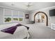 Bright, spacious bedroom with large windows offering scenic views and a cozy seating area at 220 Villa Borghese St, Las Vegas, NV 89138