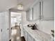 Gray butler's pantry featuring marble countertops and dark wood floors at 220 Villa Borghese St, Las Vegas, NV 89138