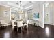 Elegant dining room features a chandelier, decorative wallpaper, and plenty of seating at 220 Villa Borghese St, Las Vegas, NV 89138