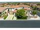 Aerial view of a luxurious home featuring a landscaped front yard, three car garage and beautiful desert landscaping at 220 Villa Borghese St, Las Vegas, NV 89138