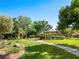 Community gazebo surrounded by lush green grass and mature trees at 220 Villa Borghese St, Las Vegas, NV 89138