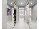 Hallway features a view into the bathroom and closet with stylish mirrors and neutral colors at 220 Villa Borghese St, Las Vegas, NV 89138