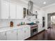 Modern kitchen featuring marble countertops, stainless steel appliances, and white cabinetry at 220 Villa Borghese St, Las Vegas, NV 89138