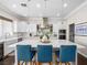 Modern kitchen features a spacious island with seating, stainless steel appliances, and pendant lighting at 220 Villa Borghese St, Las Vegas, NV 89138