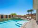 Inviting pool area with sun loungers and lush landscaping at 220 Villa Borghese St, Las Vegas, NV 89138